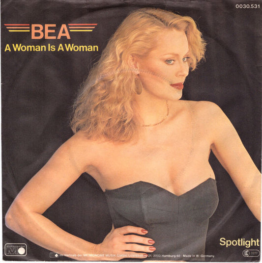 Bea : A Woman Is A Woman (7", Single)