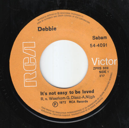 Debbie (6) : It's Not Easy To Be Loved (7", Single)